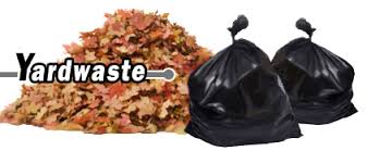 Pile of leaves with black garbage bags
