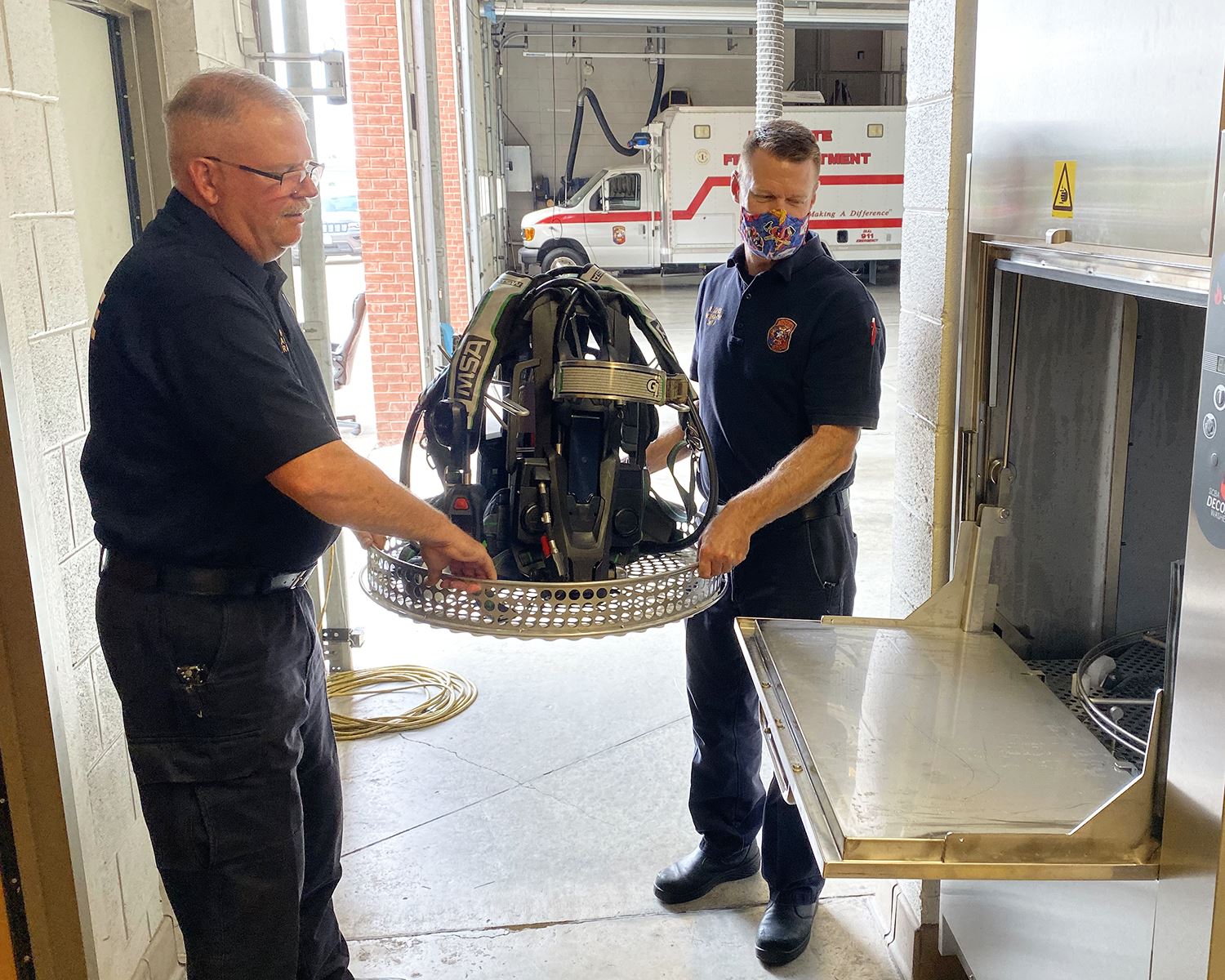 Mesquite Fire - placing SCBA in washer 2