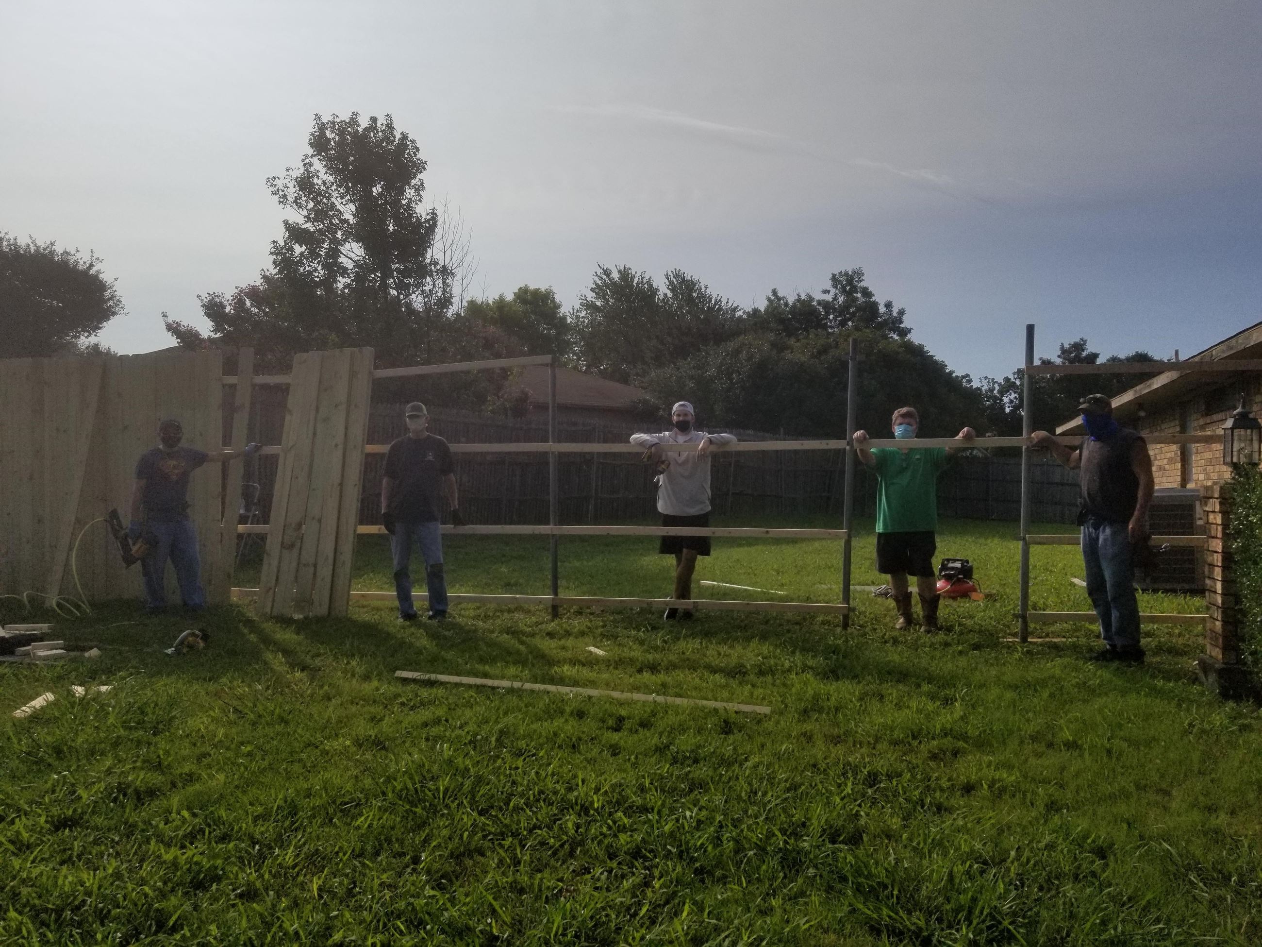 Neighbors build fence for elderly neighbor