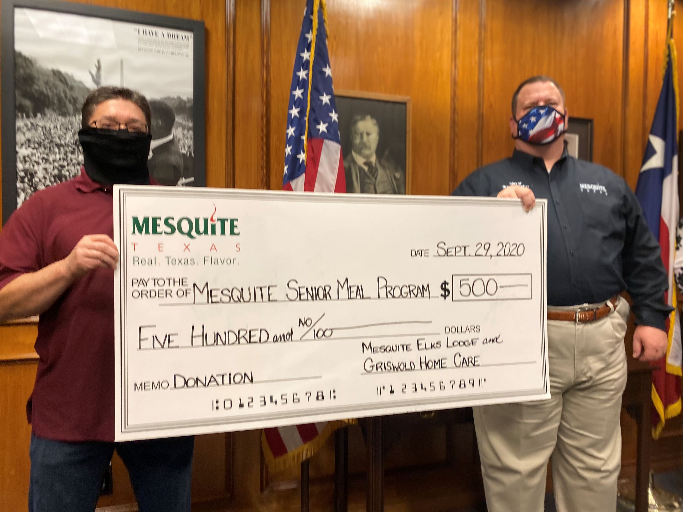 Mike Gibson and Mayor Bruce Archer check presentation