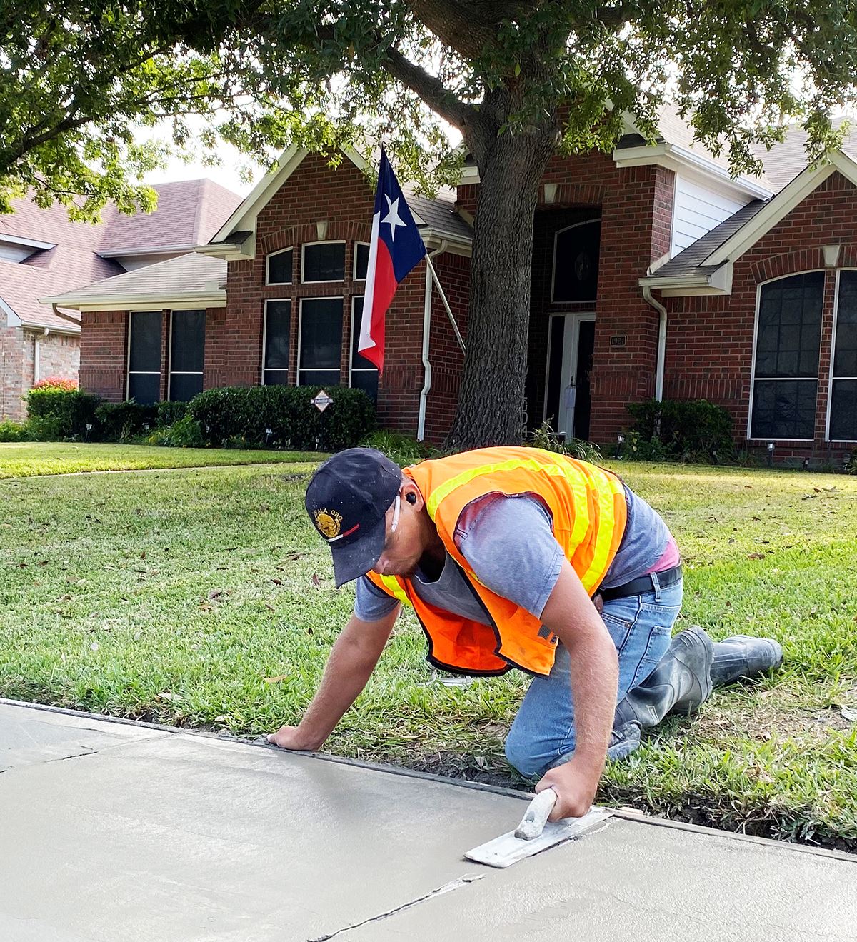 Real Texas Roads residential street repair program - Mesqute TX - sidewalk repair with TX Flag