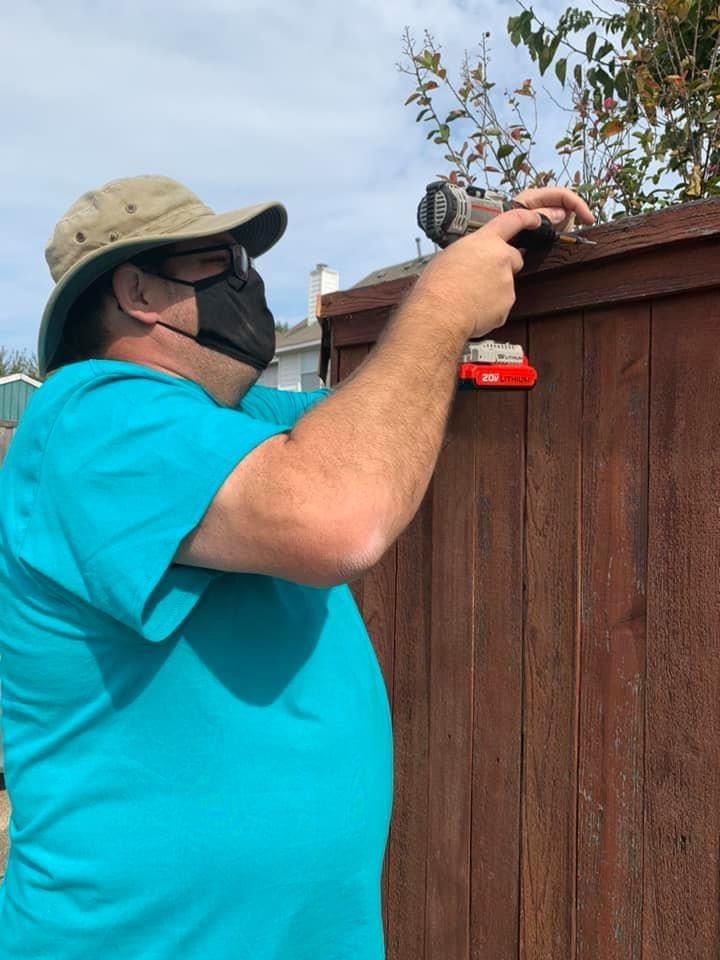 Addressing Mesquite Day 2020 man fixing fence