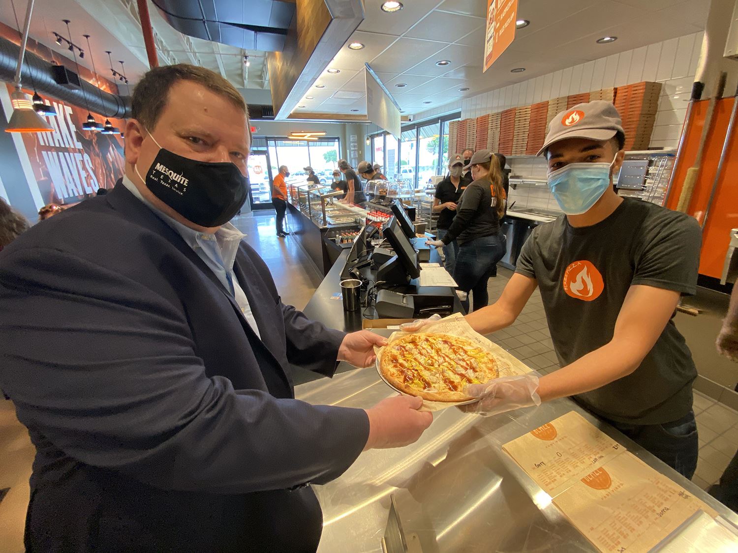 5-4-21 Baze employee serves mayor his pizza