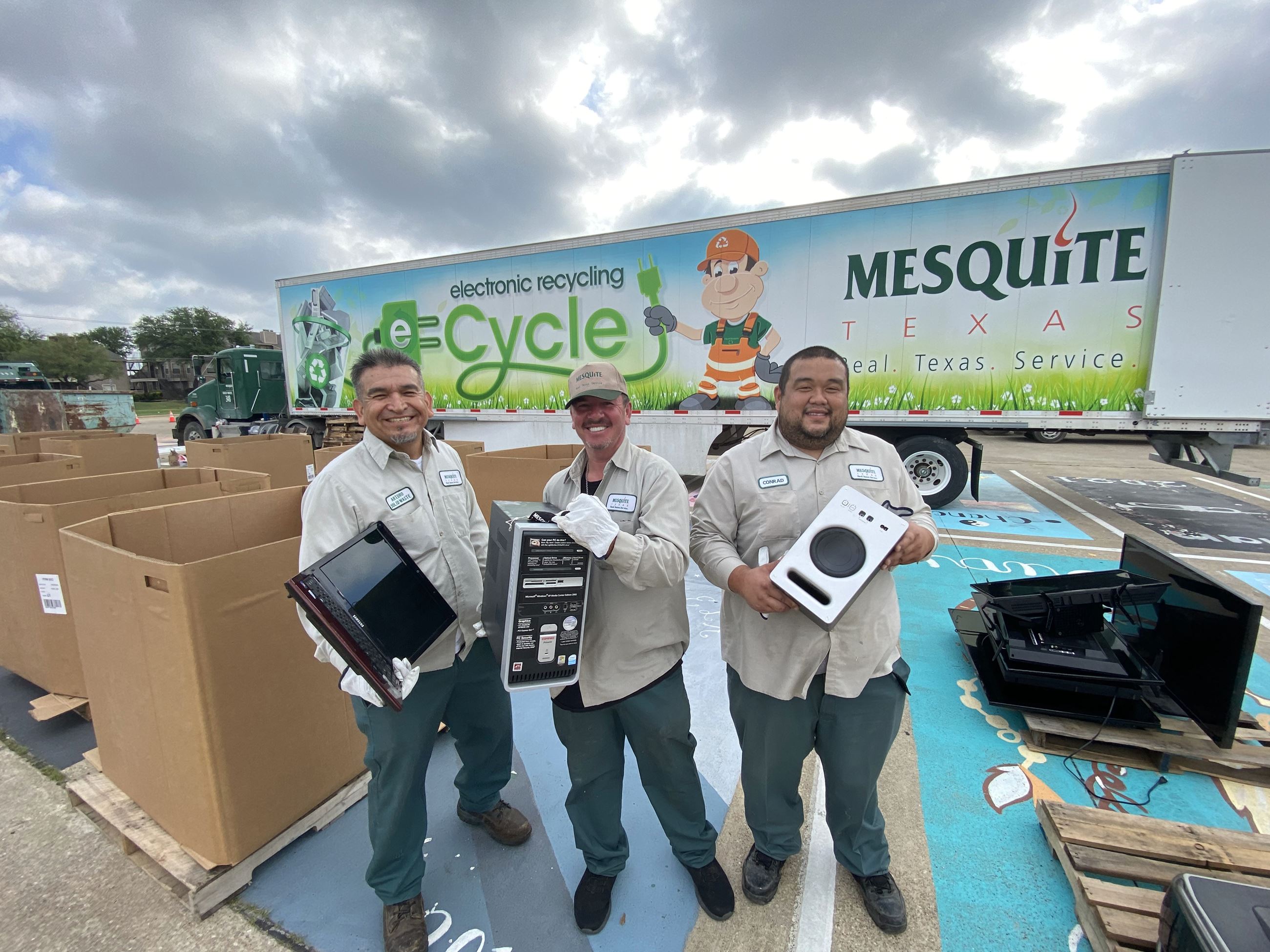 employees collect electronic material for recycling