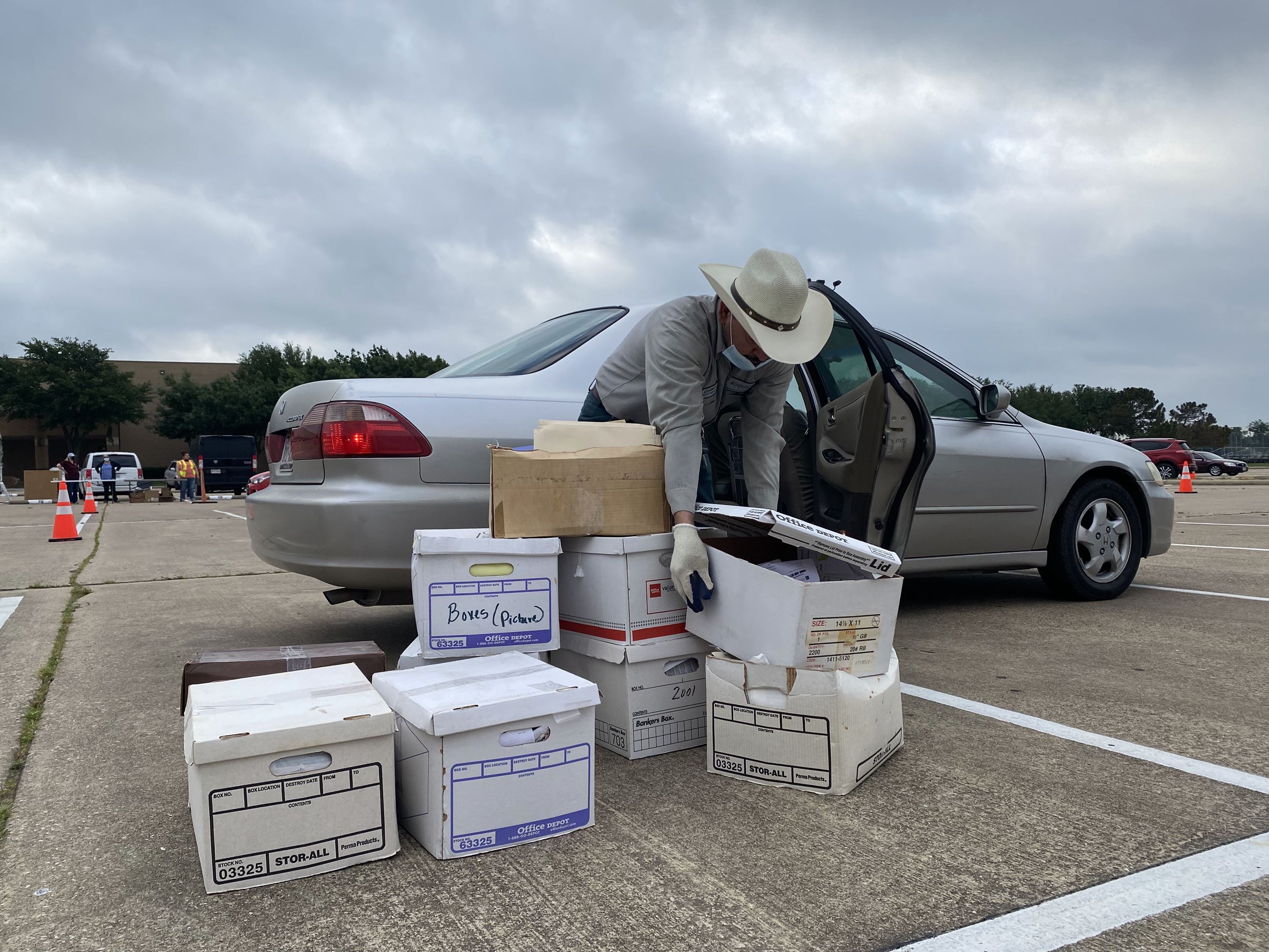 employee removes paper recycling for document shredding