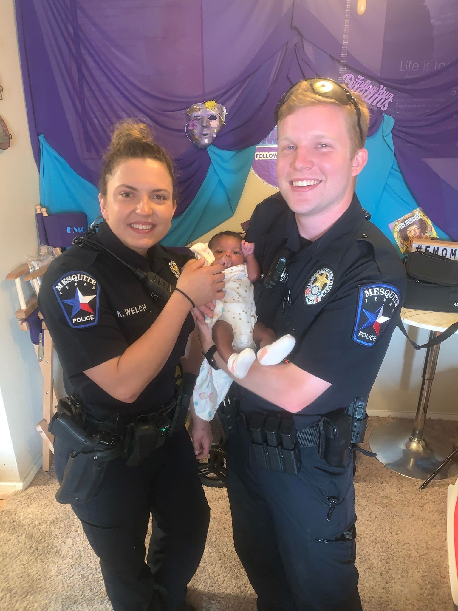 Officers Pecena and welch with newborn baby