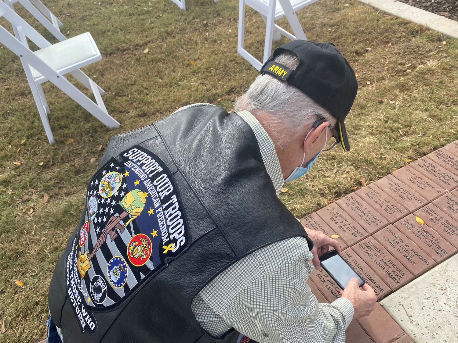 Mesquite Veterans Memorial - military veteran takes photo of his brick on Walk of Honor - Mesquite T