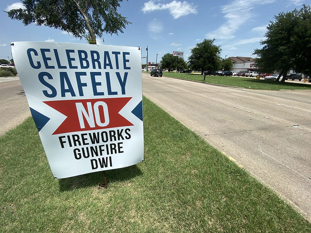 Celebrate Safely - No Fireworks Gunfure DWI median sign - Mesquite TX