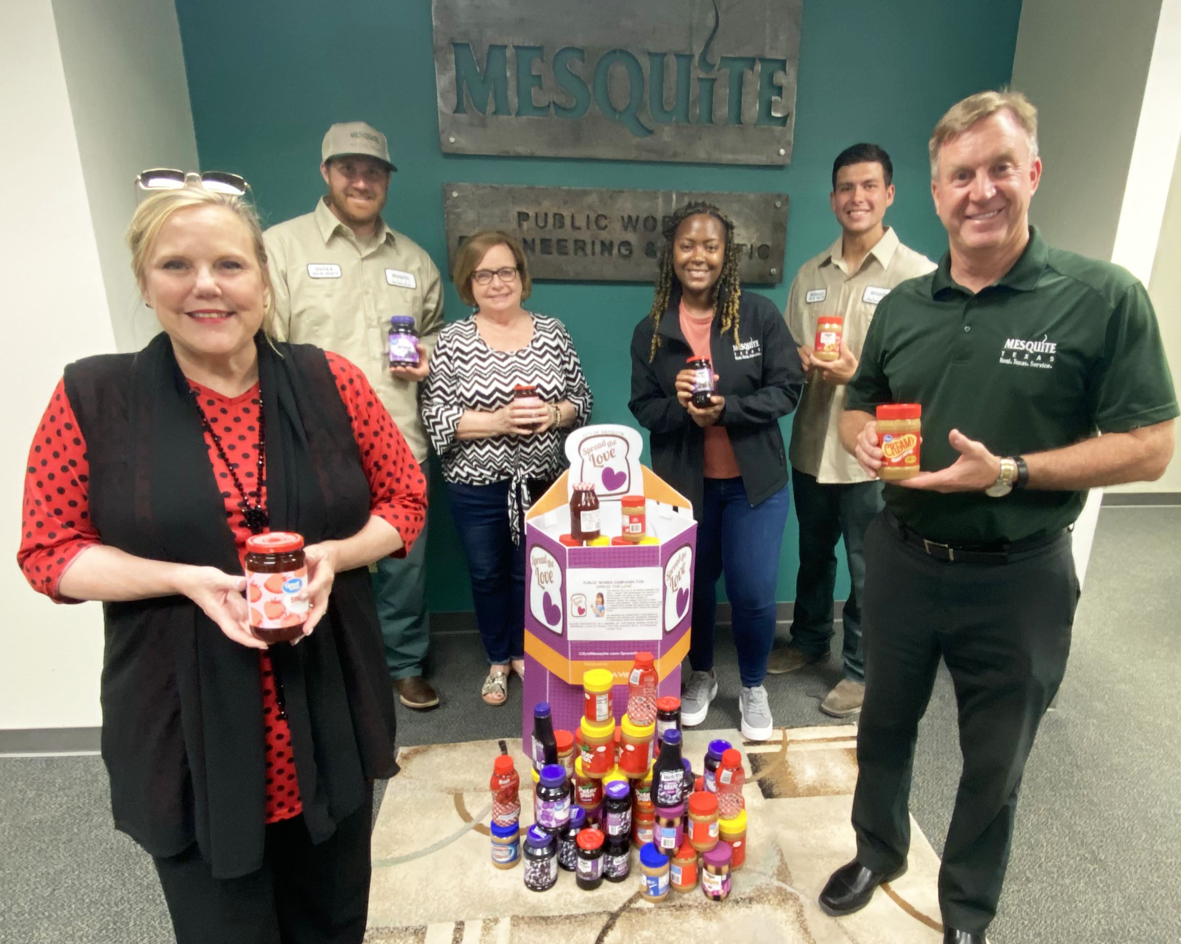 7-16-21- Sharing Life CEO Teresa Jackson accepts PBJ donations from Citys Public Works Dept employee
