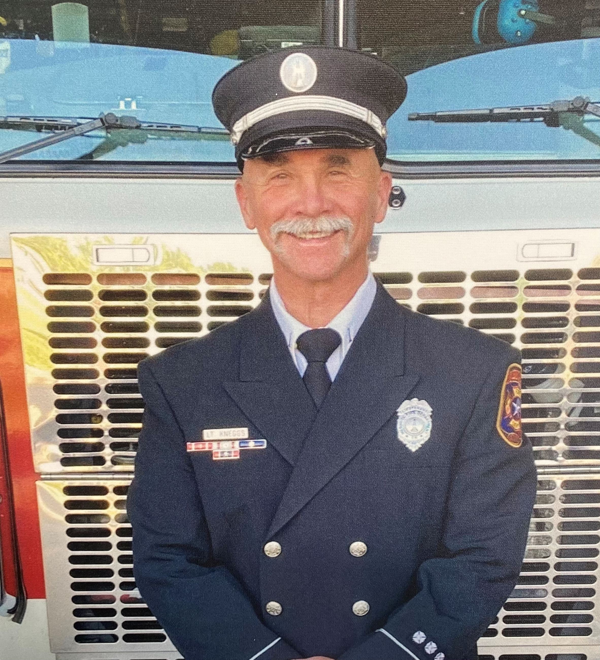 Lt. Kneggs infront of fire truck