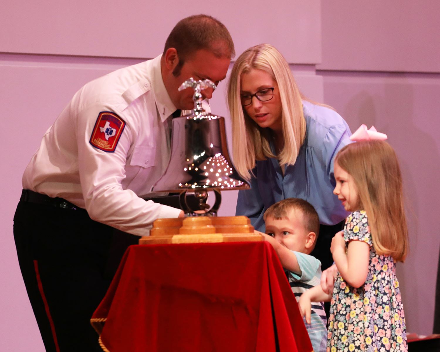 8-5-21 MFD Promotional and Swearing-In Ceremony - Lt. Jacob Heise rings ceremony bell with family - 