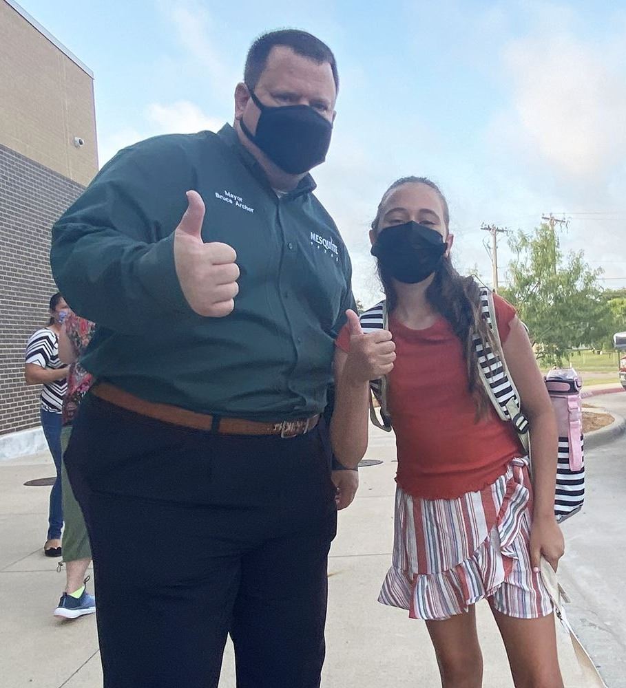 Mayor and student thumbs up