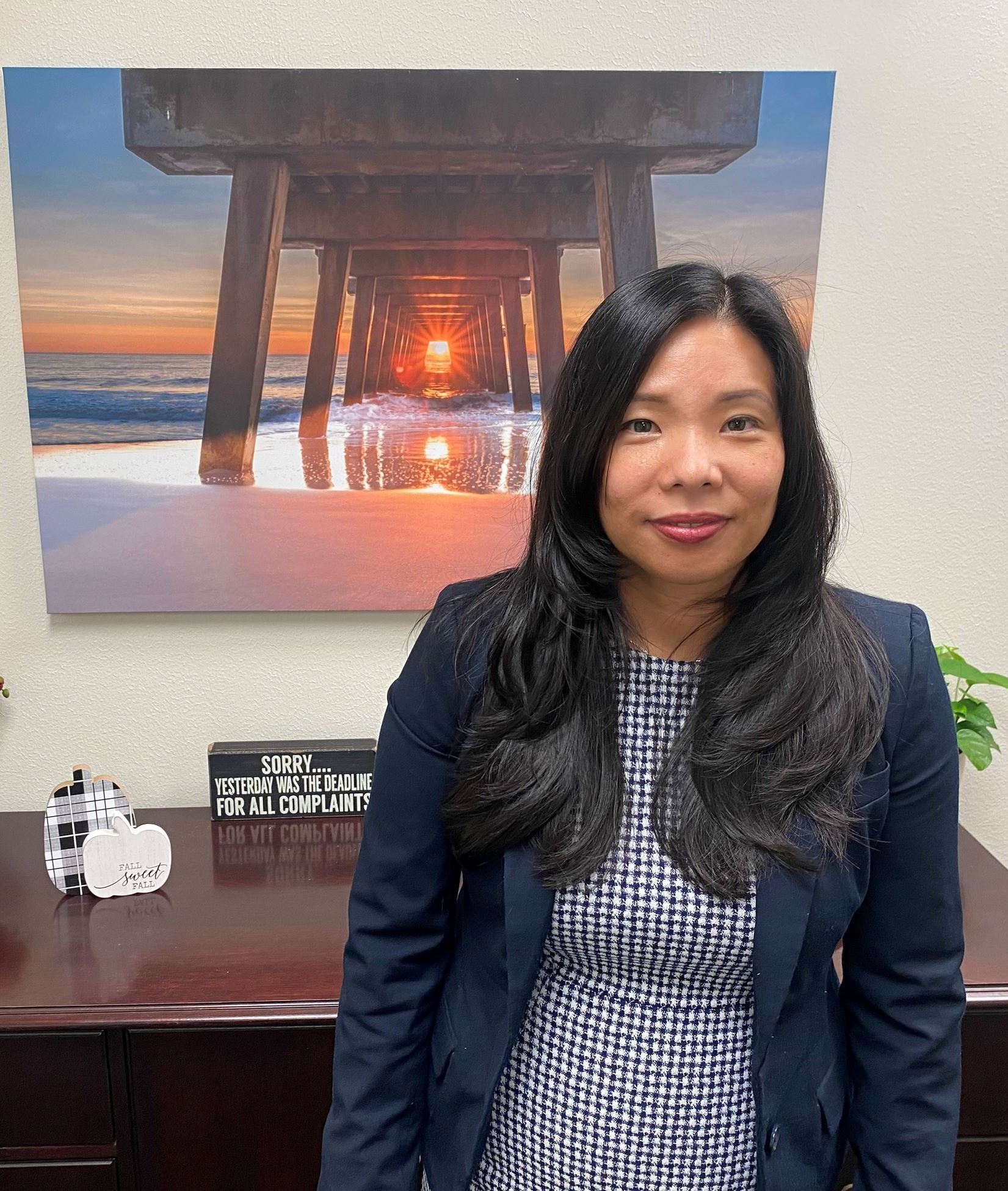 Rita Ballard in front of desk