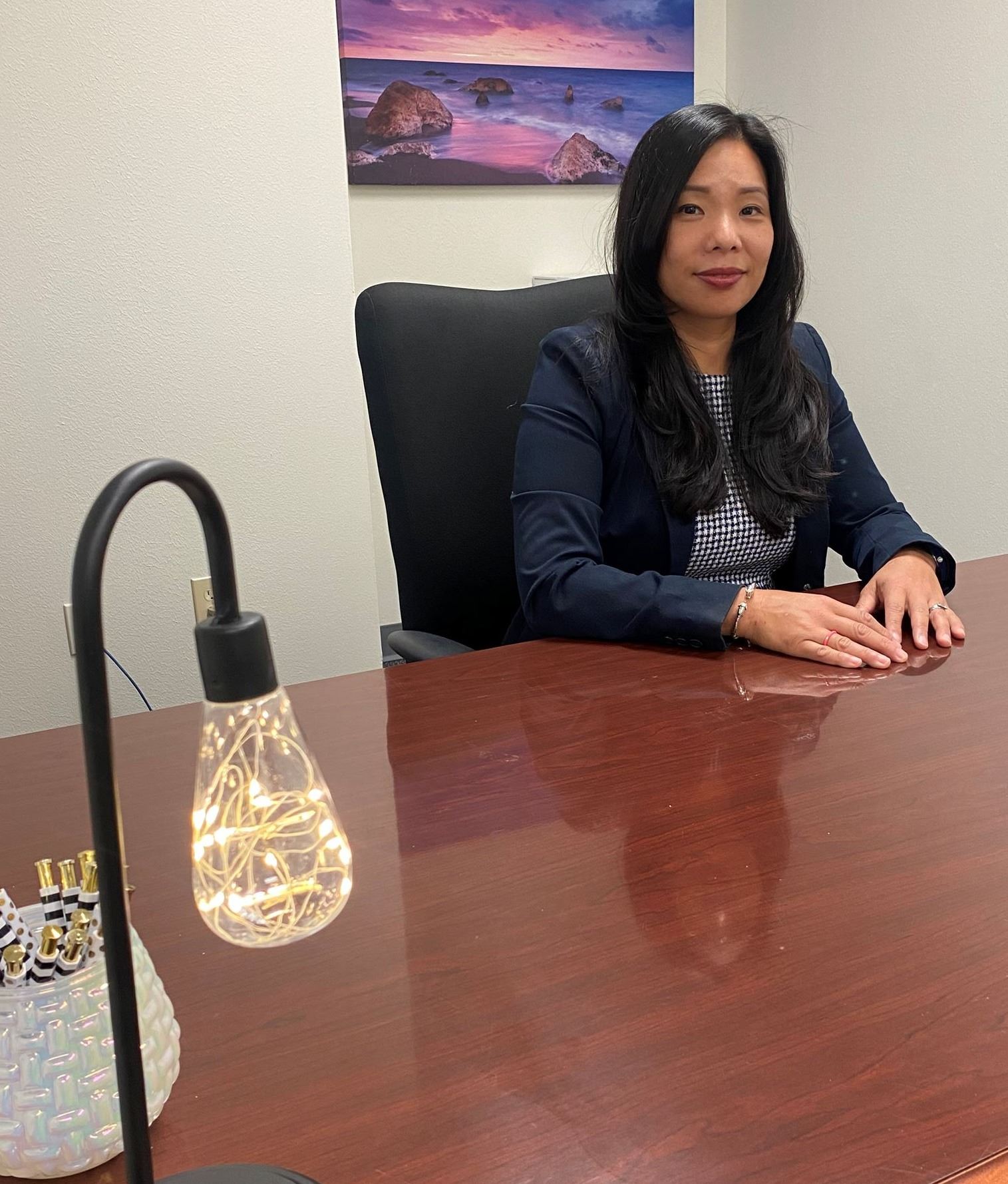 Rita Ballard sitting at desk