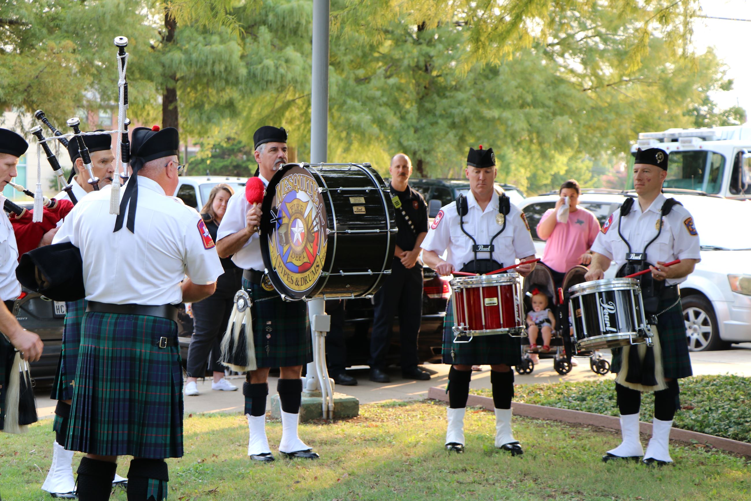 band and bagpipes play