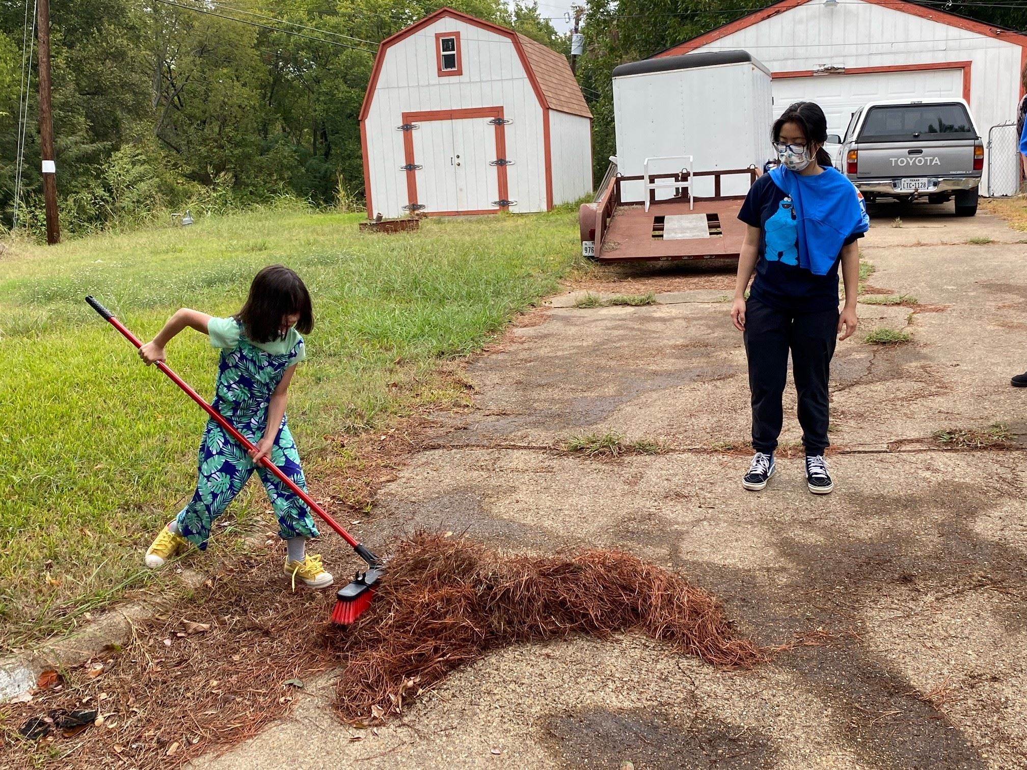 little girl sweeping