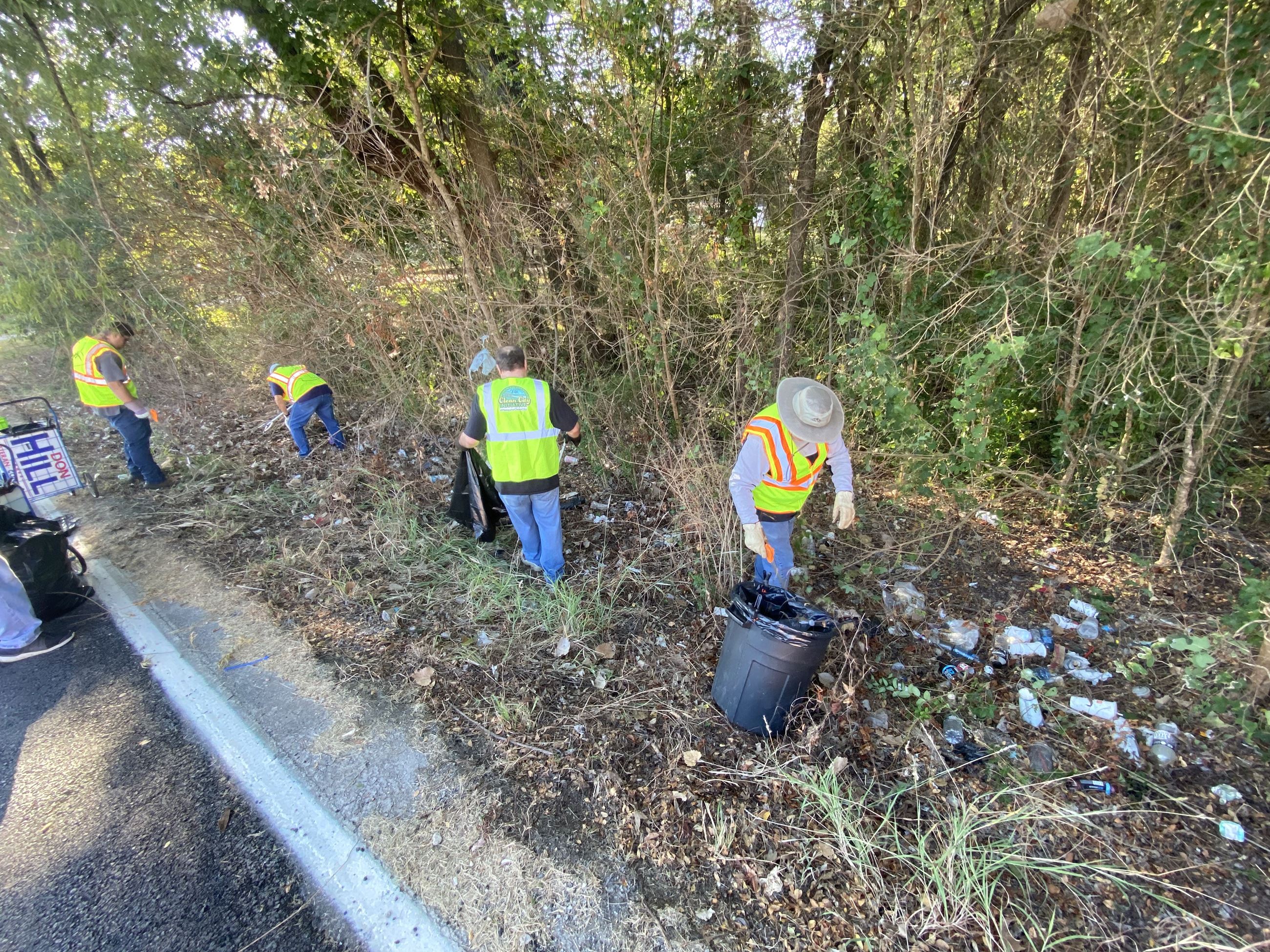 cleaning up trash along road