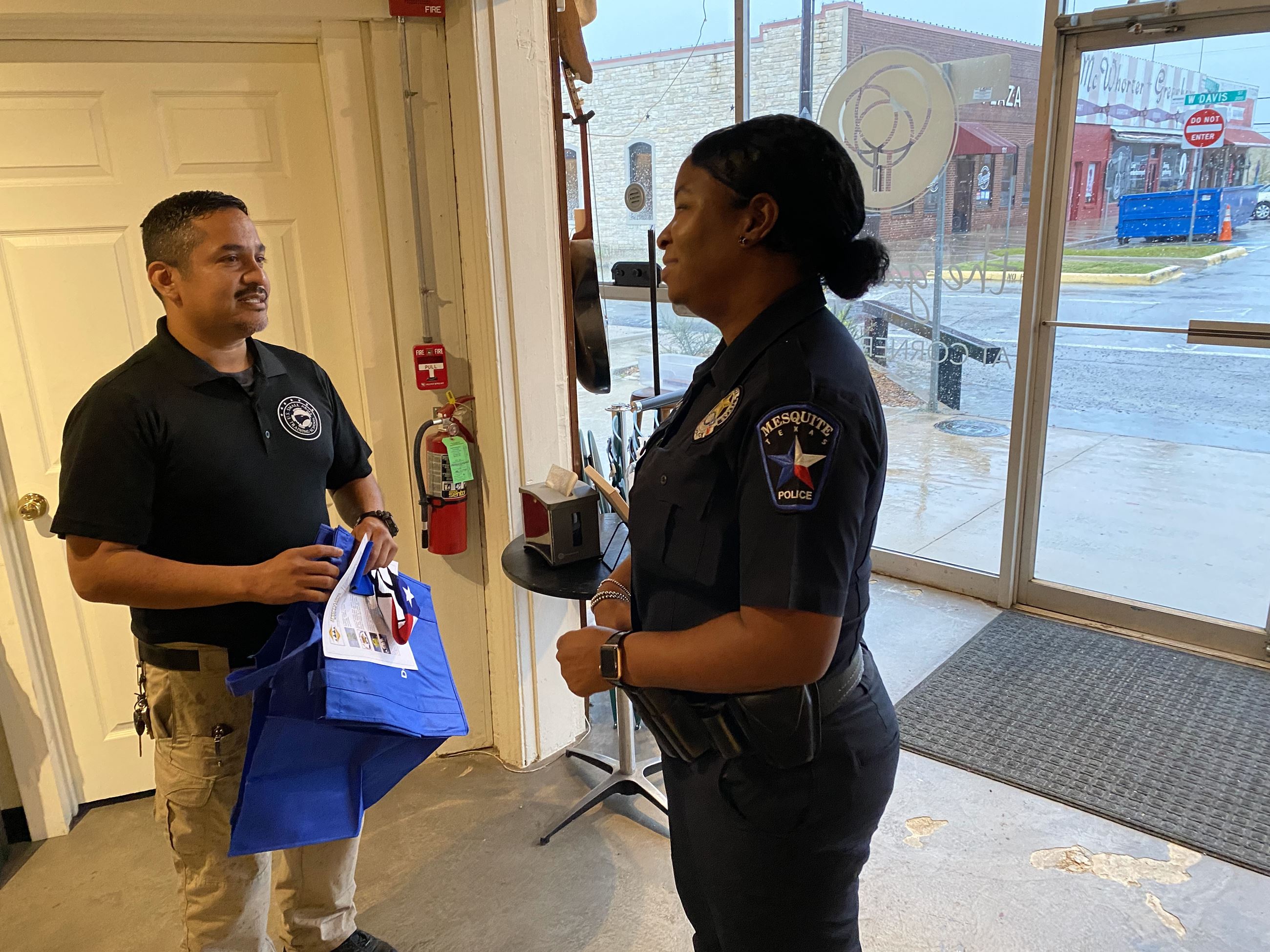 mans talks to officer