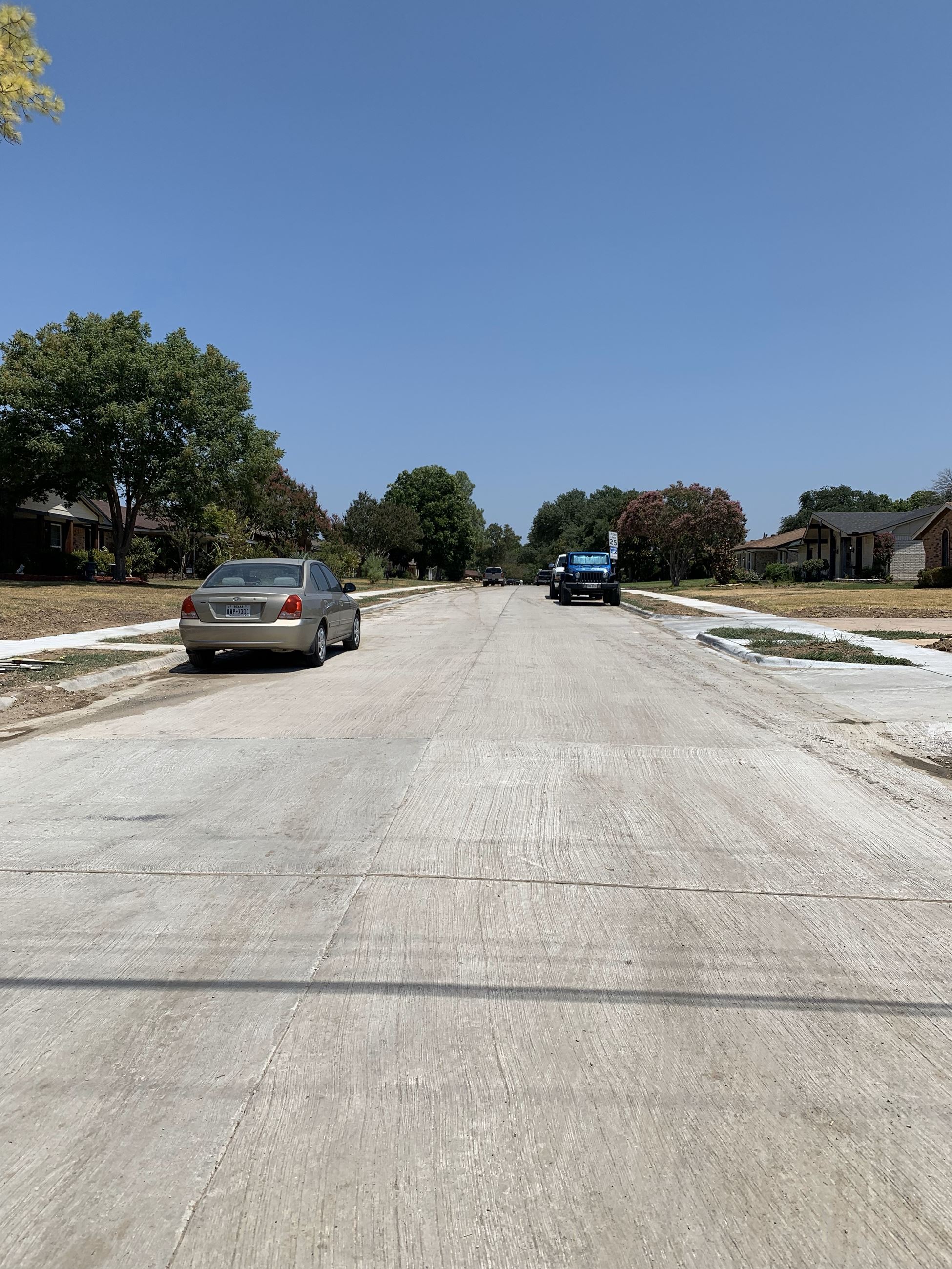 whitish-gray pavement on a residential street