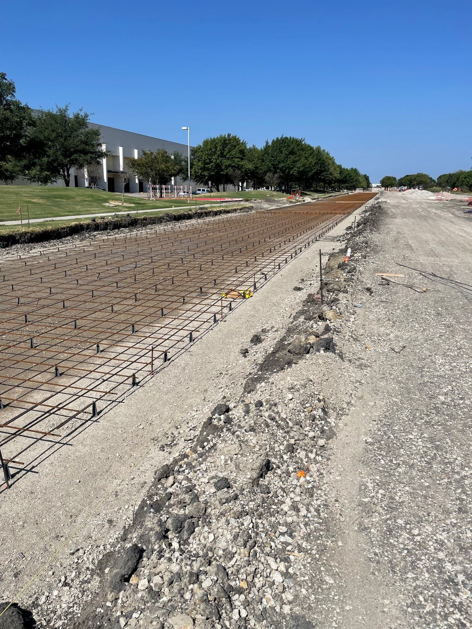 roadway under construction with metal rebar showing