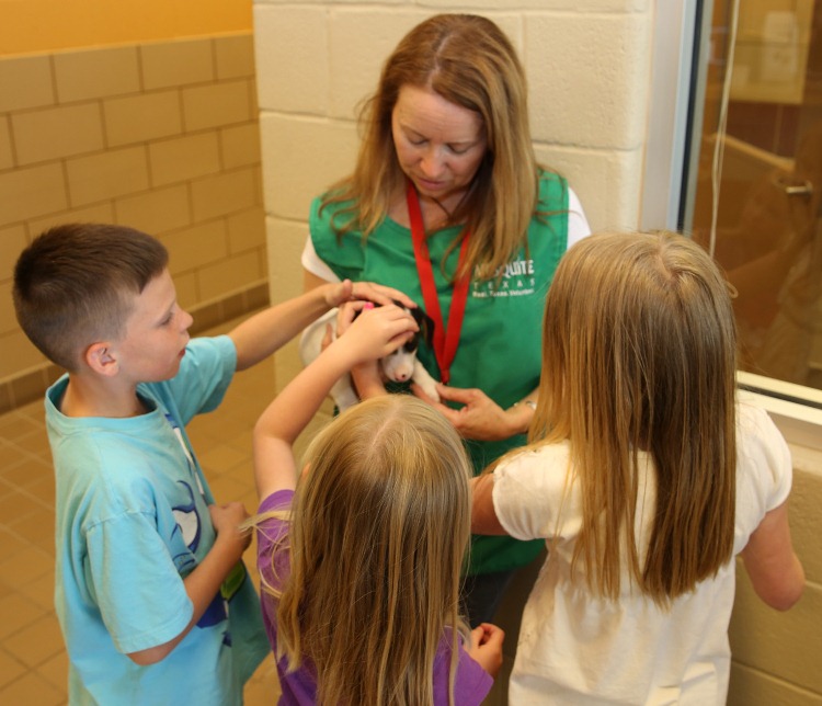 Animal Shelter volunteers with pet